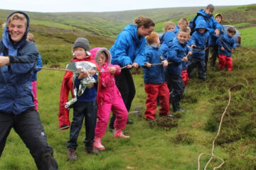 A group of children pulling a rope