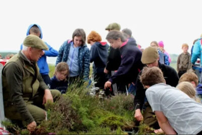 A group of children looking at plants