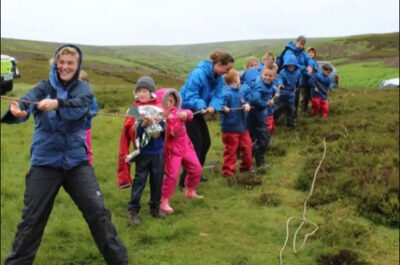 A group of children pulling a rope