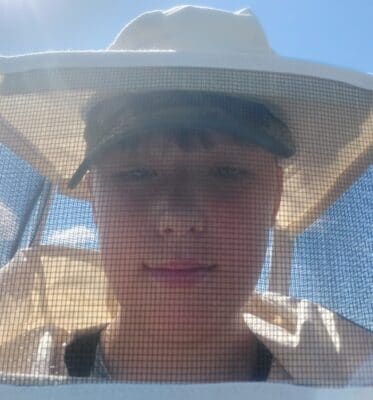 James Kinghorn in a beekeeper suit